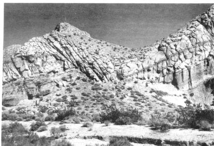 Plate 3-Faulted pink tuff in lower Ricardo Formation, Red Rock Canyon. Stop 3. Photo by Bruce Bilodeau.